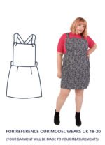 Mary wearing a black and white printed mini dress with a pink top underneath. Mary is stood with one hand on her right hip and is looking at the camera.