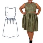 Charlotte is wearing a black sparkly gathered skirt two-piece and is stood with her back to the camera